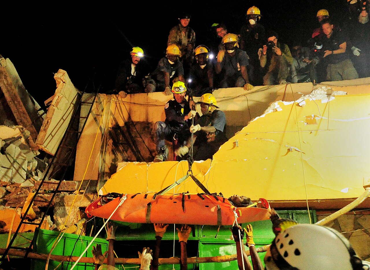 US Navy 100119-N-2953W-171 Search and Rescue teams rescue Hottline Lozoma, a 25-year-old Haitian woman, who was trapped in rubble for eight days