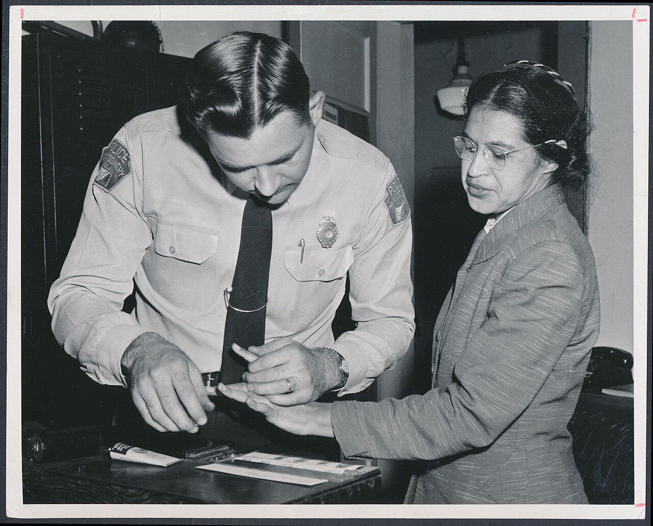 Rosa Parks being fingerprinted by Deputy Sheriff D.H. Lackey after being arrested on February 22, 1956, during the Montgomery bus boycott - Original