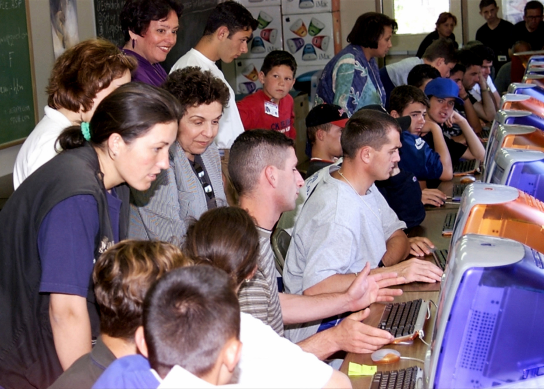 Donna Shalala stands amongst a group of Kosovo refugees