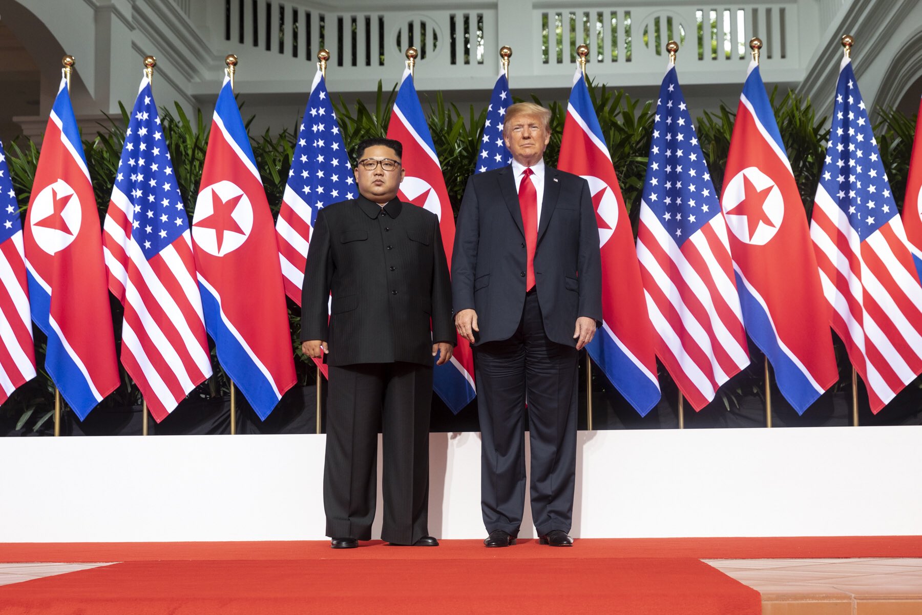 Trump and Kim pose a photo before Singapore Summit