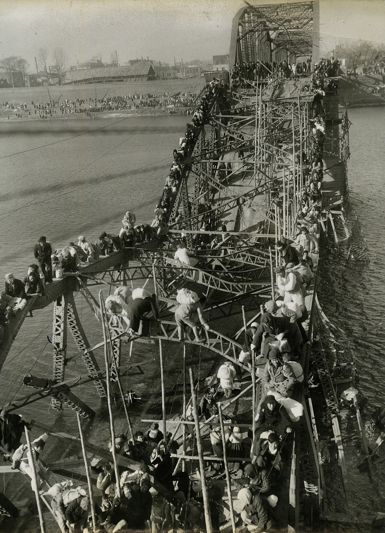 Flight of Refugees Across Wrecked Bridge in Korea