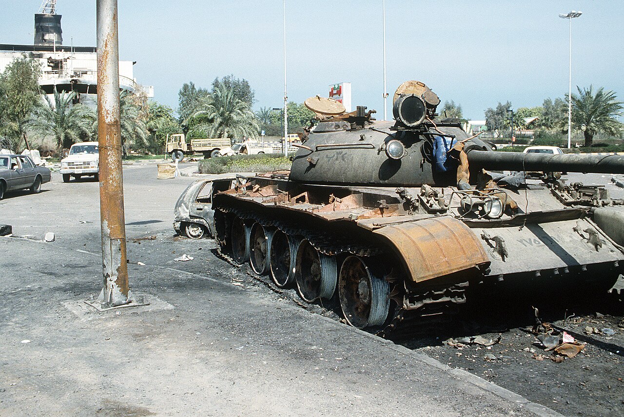Disabled Iraqi T-55 tank lying along Basra-Kuwait Highway